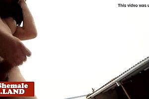 In the open air a transgender woman pleases herself