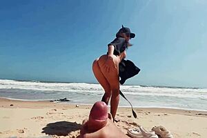 A young girl masturbates outdoors on a nude beach and gropes for feet, the last scene shows her touching a man’s penis to orgasm