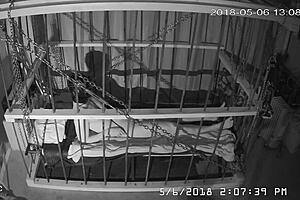 Intense cage bondage for gay slave, bound tightly in the cage