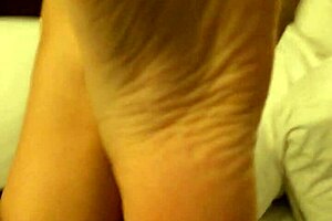 Coworker rubs high arches