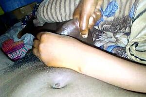 this ebony babe gives a rough handjob to a monster cock until he cums.