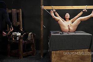 Video clip of two homosexual dominants torturing bare feet and spanking a fat girl’s soles