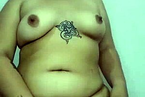 Enjoy a chubby Latin girl with brown nipples jerk off and piss