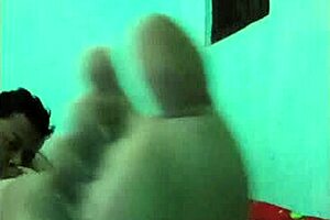 Khmer hot girl engages in detailed fucking on the bed with her friend, leading to a cumshot