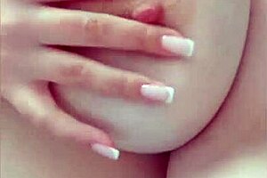 cute student on the bed, playing with her huge boobs in homemade solo