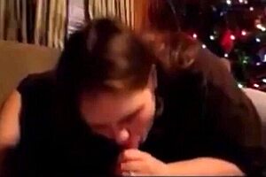Wife deepthroats husband's dick on Christmas and swallows cum.