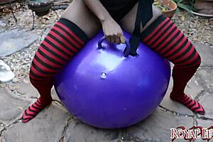 ebony woman bounces on looner balloon in exotic fetish session