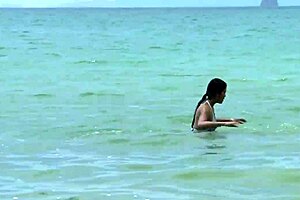 croc girl in sexy bikini poses intriguingly