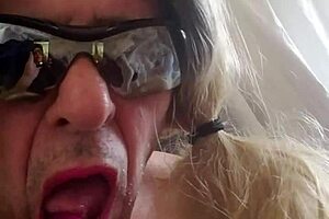 the girl in lingerie plays with dildos on her ass