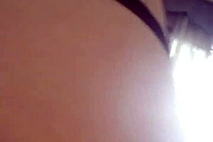 the girl in lingerie plays with dildos on her ass