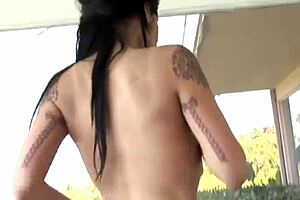 A massive ebony shaft is serviced well and hard by inked vixen