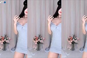 korean girl dances as skirt blows open