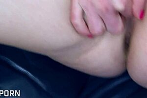 Pregnant mature milf teases with solo play on sofa. Her natural tits steal the scene!