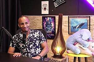 Black man sensual exposes his colorful scarves, thick, hard cock and testicles