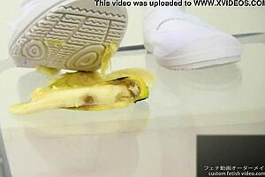 The girl says, 'watch me crush this banana with my feet.'