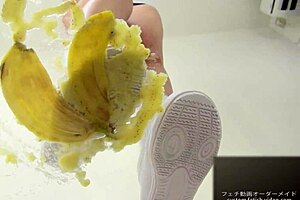 The girl says, 'watch me crush this banana with my feet.'
