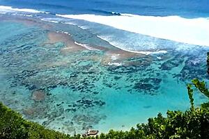 My sandy ass shows red butt plug at beach.