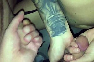 Tattoed chick sucks stranger in video booth.