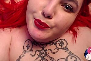 Slim redheaded woman with beautiful full breasted handling her bras