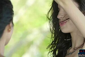 Petite Asian and Russian teen lesbians pose naked outdoors.