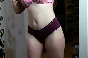 sexy brunette teases in panties during slow homemade dance