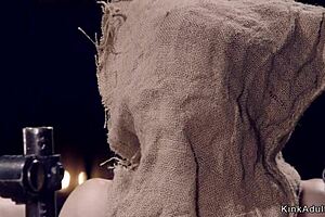 Redhead slave whipped and fingered in bondage