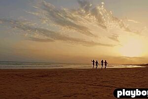 four perfect models flashing their big tits on the beach