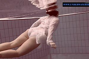 Hey, check out tattooed teen Sara swimming in clothes underwater!