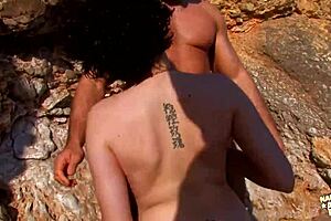 He teases her shaved pussy with fingers for outdoor anal