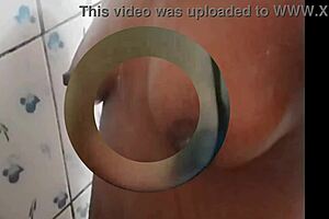 Ebony slave Cyndy Blackslave bathes in shower under master's gaze, exposing tits in homemade BDSM scene