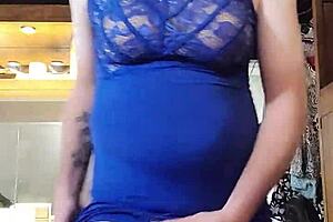 Shemale in blue dress teases cock with big tits.