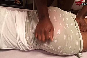 Black slut pleasures her man with an erotic rub down and hand job