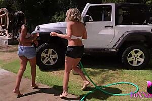 Jenna Foxx and Shy Love finger each other in the jeep outdoors.