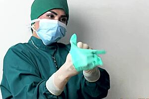 Nurse Teases Patient With Latex Gloves