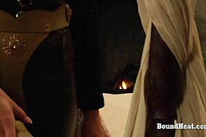 Lesbian slaves take strapon doggystyle intensely.