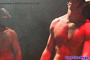 Latin muscle jock haply sodomised by a blonde masked man during gay hardcore orgy fuck party