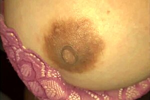 Nicholas watches a tight striptease dancer rip her clothes at the night club.