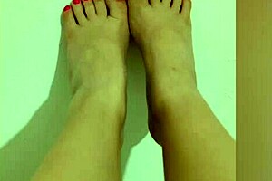 this shy teen with red pedicure is showing off her sexy legs and feet on camera