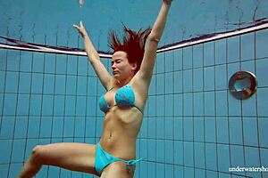 petite russian babe deniska swimming underwater in the pool