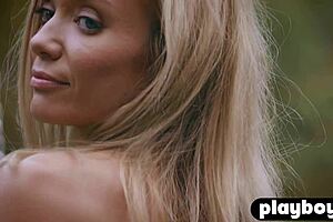 Petite 18+ blonde milf Zhenya Belaya strips outdoor for Playboy3. Her stunning body shines in the sun