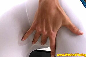 Solo European girl enjoys wetting herself and playing with sex toys.