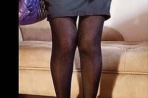 A woman pees in her shiny pantyhose during a free moment.