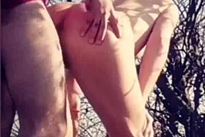 I push his cock deep down her throat in the field for face fucking