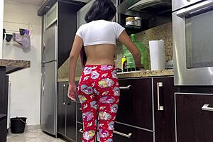 I have a great view of my stepdaughter’s curvaceous body while she is cooking.
