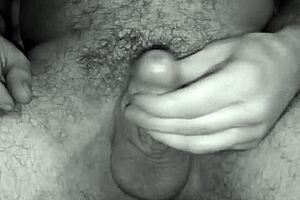 Satisfied cock toy enjoys playing with the balls after a good round of masturbation