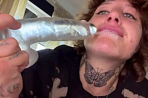 A girl with tattoos gives rough blow job until she cries and then sucks a dildo.