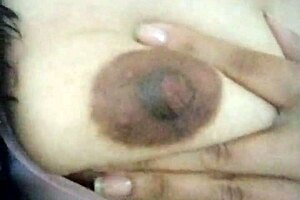 Feeling horny, I touch myself in grandma's living room with small tits exposed.