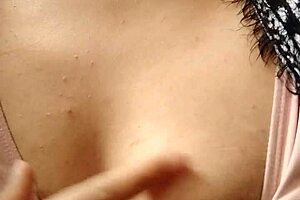 Feeling horny, I touch myself in grandma's living room with small tits exposed.