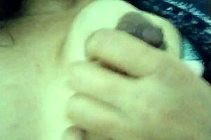 Feeling horny, I touch myself in grandma's living room with small tits exposed.