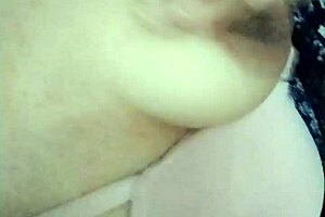 Feeling horny, I touch myself in grandma's living room with small tits exposed.